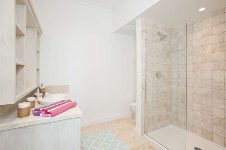 Typical master bedroom en-suite bath with walk-in shower.