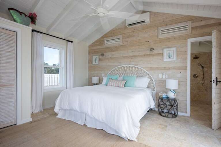 Guest cottage suite with king bed, ocean view, and en suite bath.