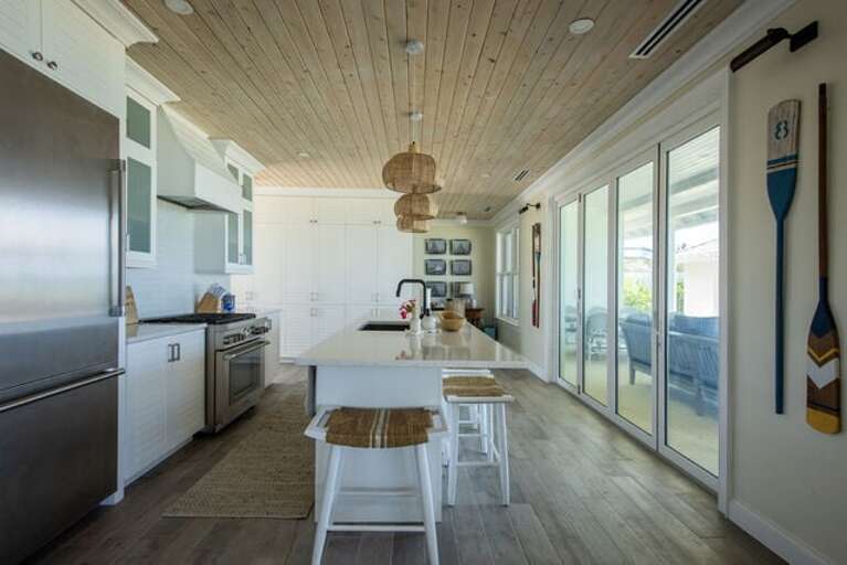 Kitchen and bar with additional seating.