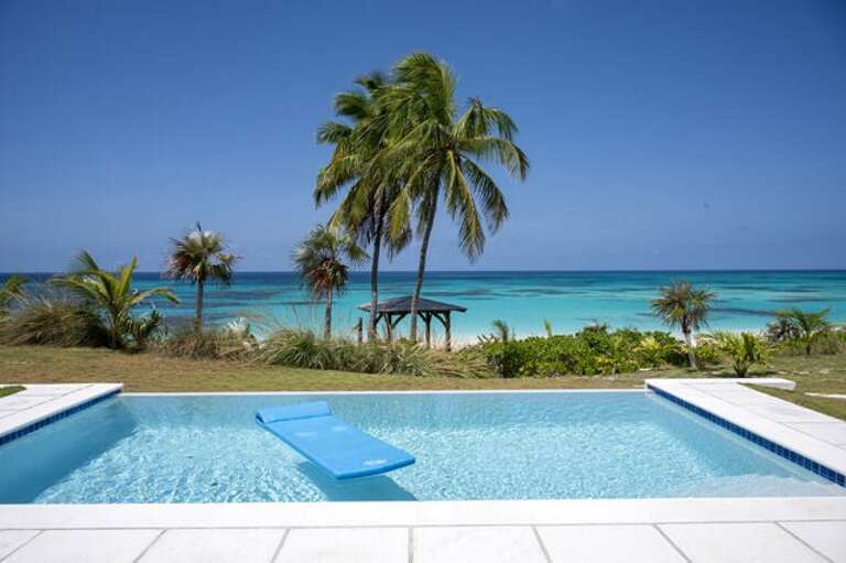 Pool with view of gazebo.