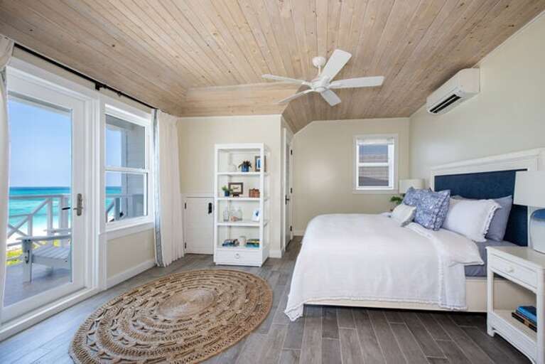 Upstairs master with king bed, ocean view, and en-suite full bath.