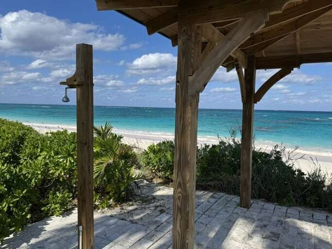 Our beach palapa with outdoor shower.