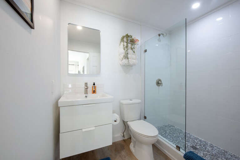 Bath with walk-in shower.