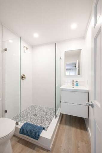 Bath with walk-in shower.