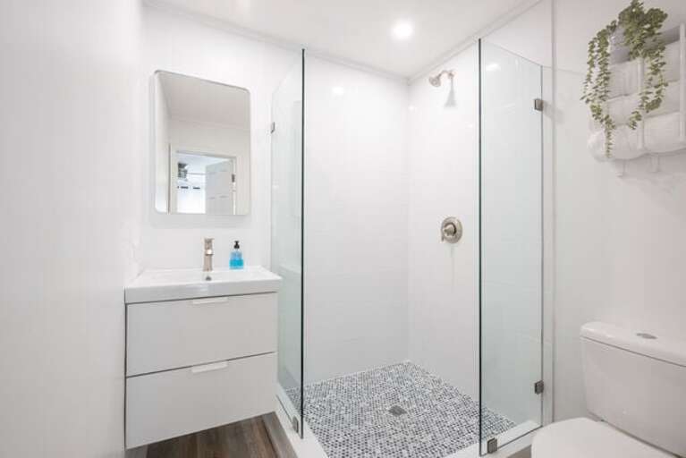 Bath with walk-in shower.