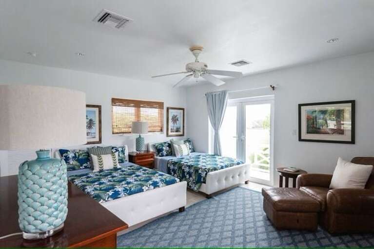 Bedroom 2 in the cottage. Two double beds with en-suite bath.