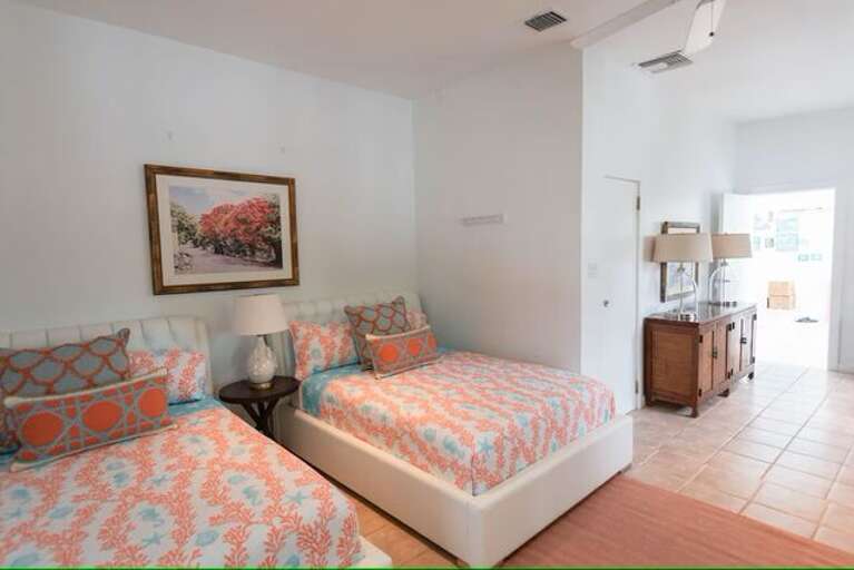 Bedroom three - main house - two double beds with attached bathroom.