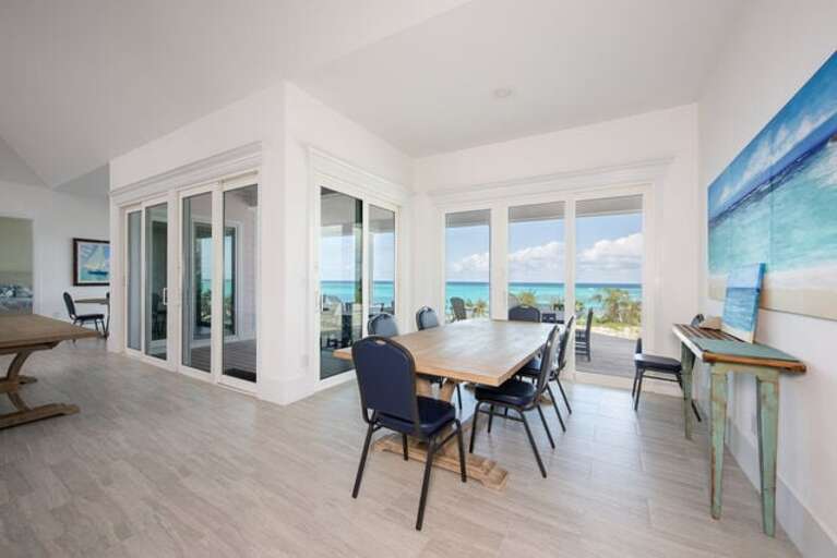 One of three dining tables, all with ocean views.