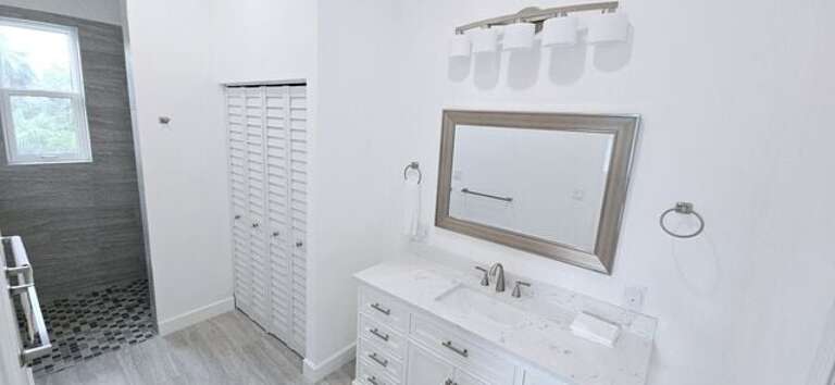 First of four luxurious en-suite baths with a large walk-in shower.