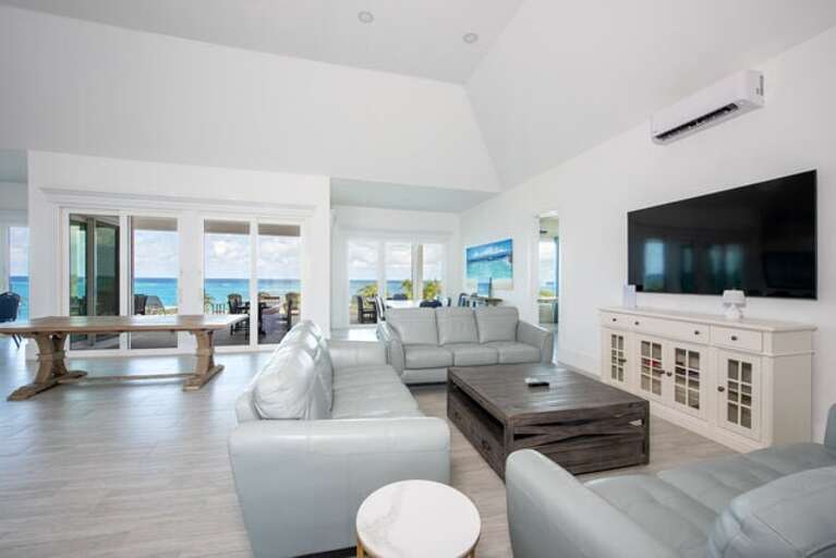 Open-plan great room with spectacular ocean views. (We do have chairs for that dining table!)