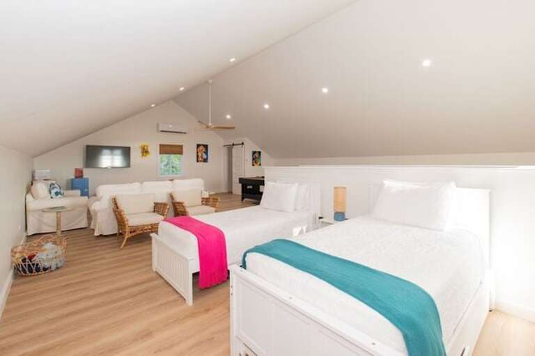 The upstairs sitting area is designed for fun and relaxation.  Two of the twin beds also have trundle beds.