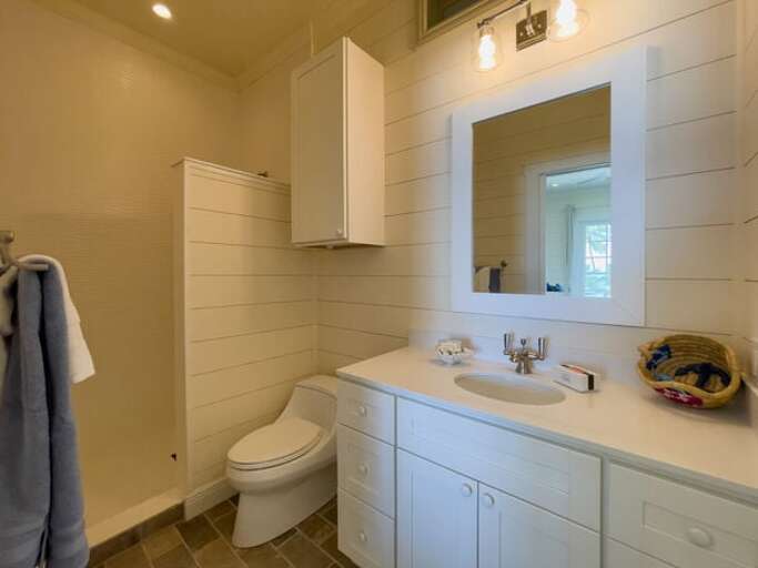 En suite bath with walk-in shower.