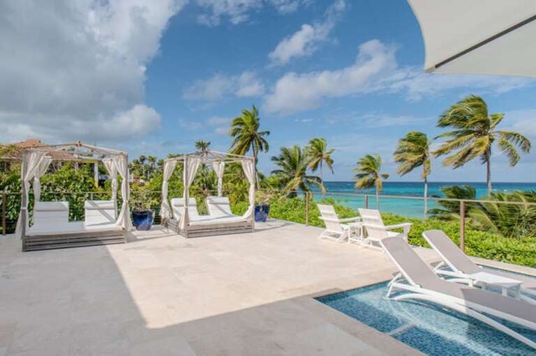 Large oceanfront pool deck with a variety of seating choices.