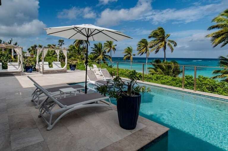 Almost every room opens up to the 1,850 sq ft pool deck that includes the 14'x30' heated pool.