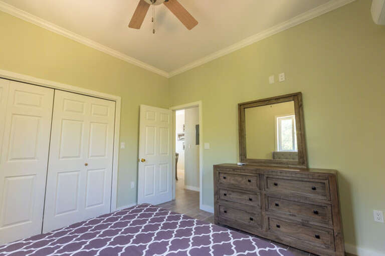 The second bedroom has a queen bed.