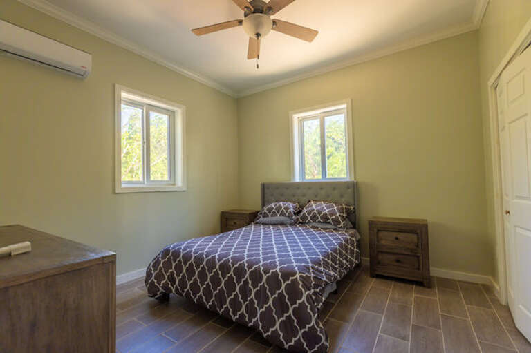 The second bedroom has a queen bed and large closet.
