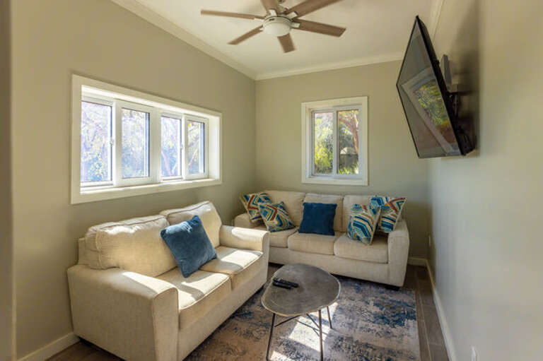 Living area with large 65-inch screen tv.