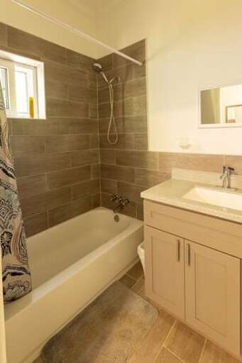 Master bathroom with bathtub and shower.
