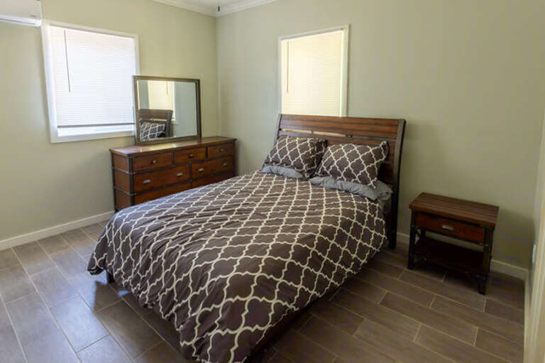 Master bedroom with queen size bed.