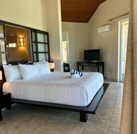 Bungalow with a king size bed.