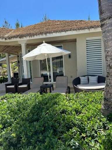 Exterior of Bungalow with seating.