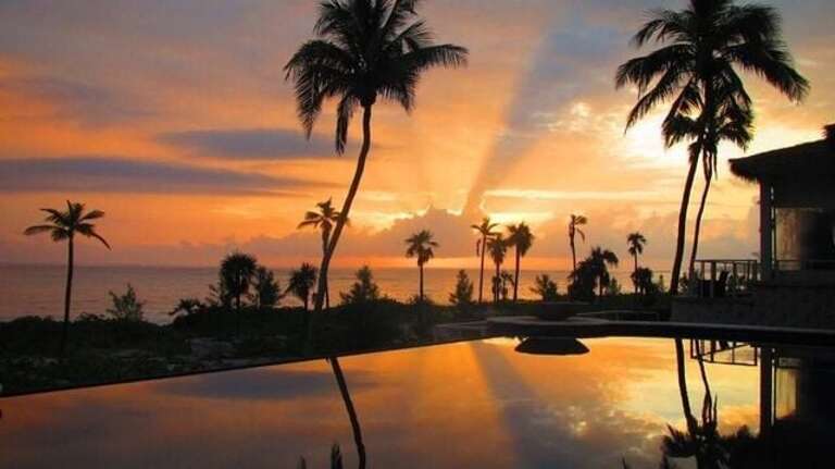 Club's pool and restaurant at sunset