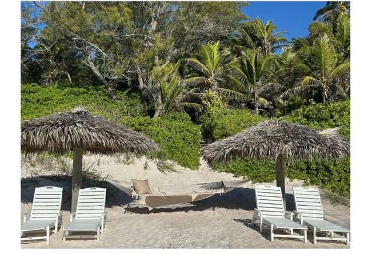 Two thatched beach cabana's, your and yours alone.
