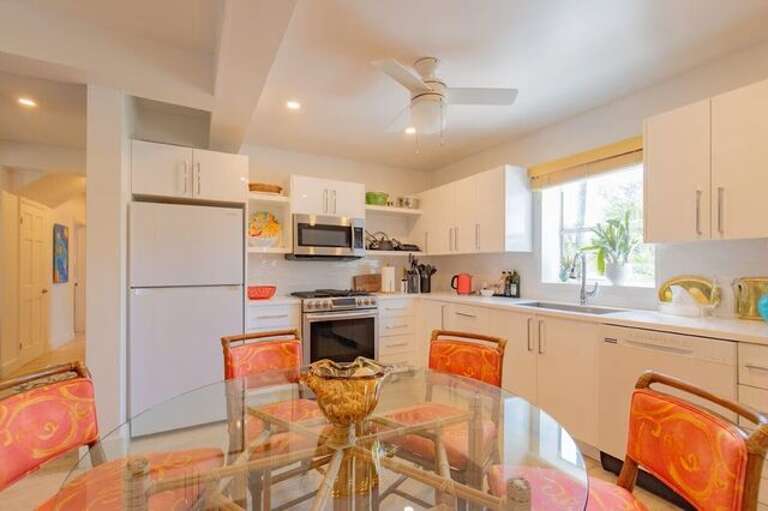 With ample space for a 6-seat dining area, this kitchen is sure to be the hub of gatherings and memorable meals.