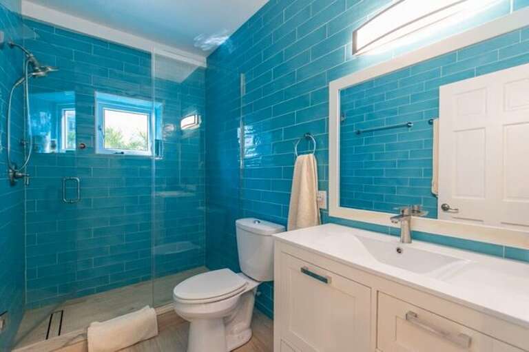 Bath with walk-in shower.