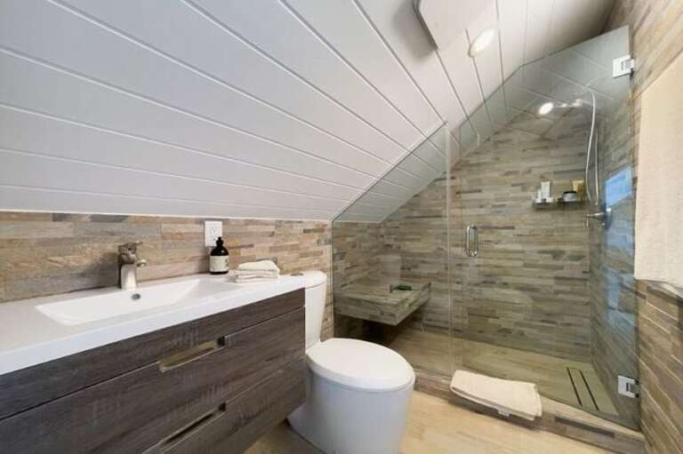 Bath with walk-in shower.