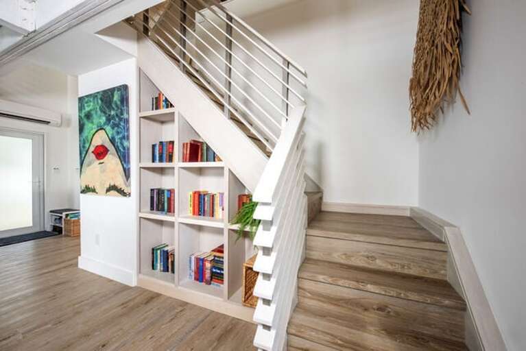 Stairs to Master Bedroom Suite, which takes up the entire top floor.
