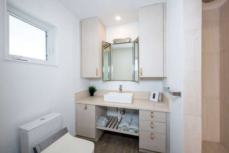 Cottage's guest bath with walk-in shower.