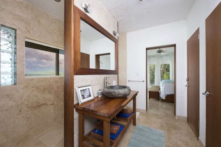 The Villa's first floor features two bedrooms seamlessly integrated with a spacious bathroom.