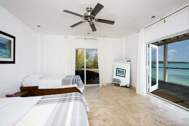 The second downstairs bedroom has twin beds and also enjoys a spectacular ocean view.