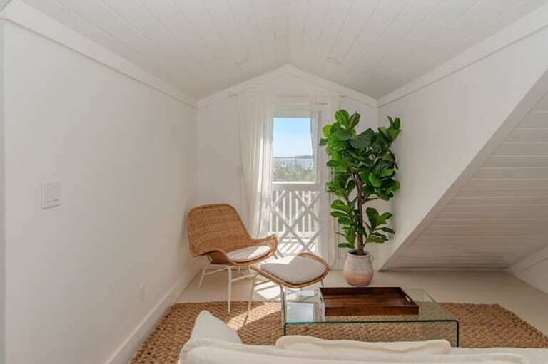 The third bedroom showing bed and sitting area.