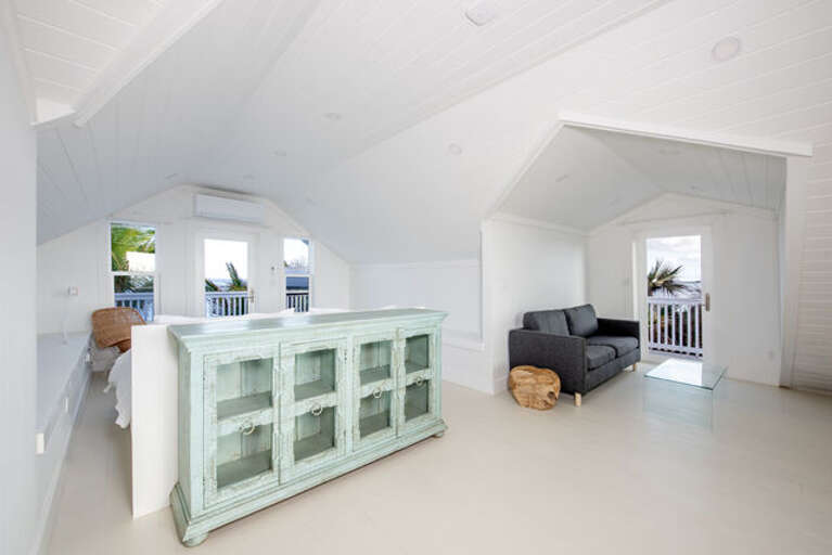The third bedroom showing bed and sitting area.