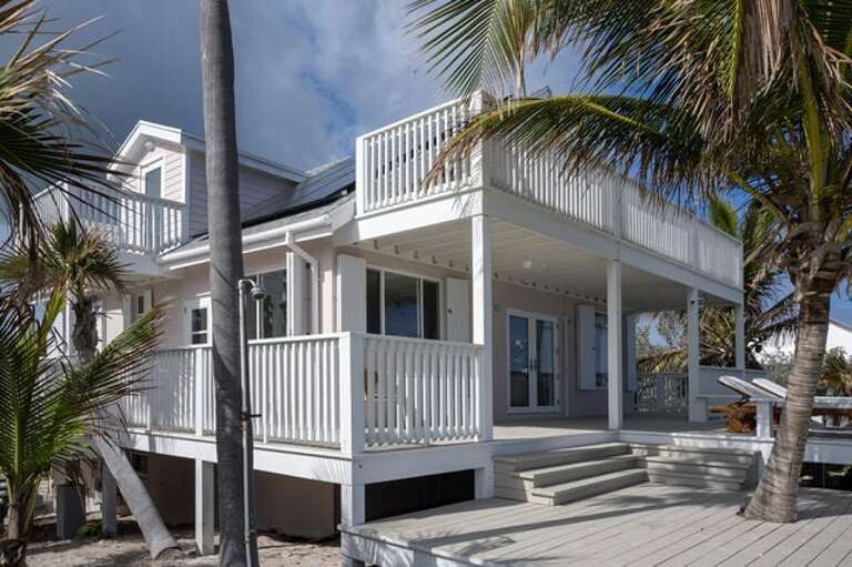 Completely remodeled home sits directly on stunning Double Bay Beach.