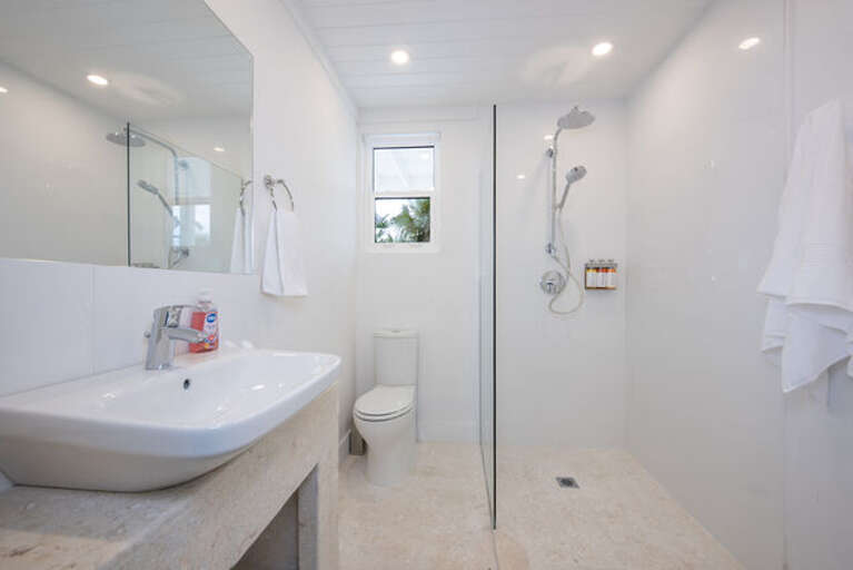 En suite full bath with walk-in shower.