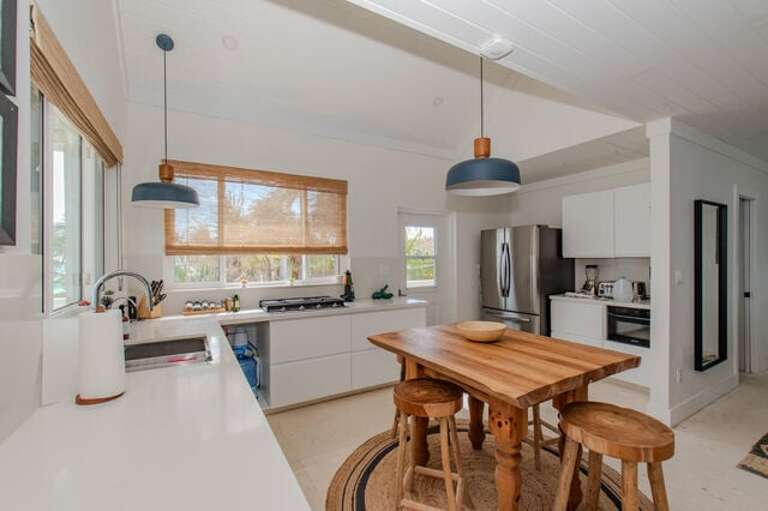 Fully equipped Kitchen with additional seating.