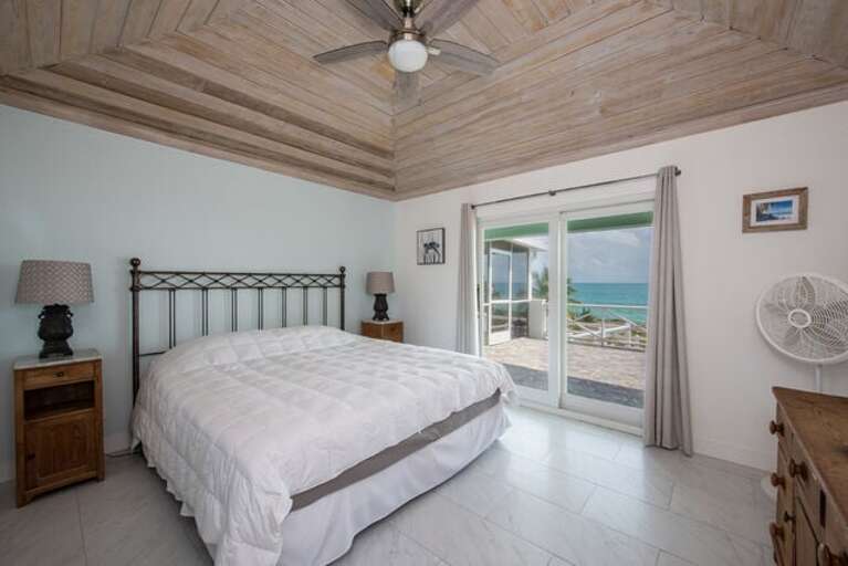Second bedroom with a king bed and an ocean view.