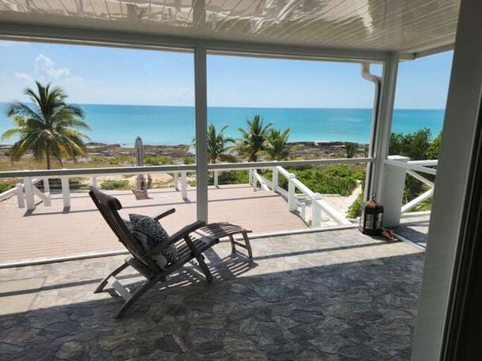 Enjoy the breeze on the covered, enclosed porch
