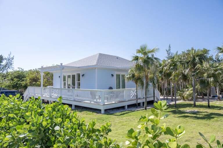 Silver Palms steps from pink sand beach.