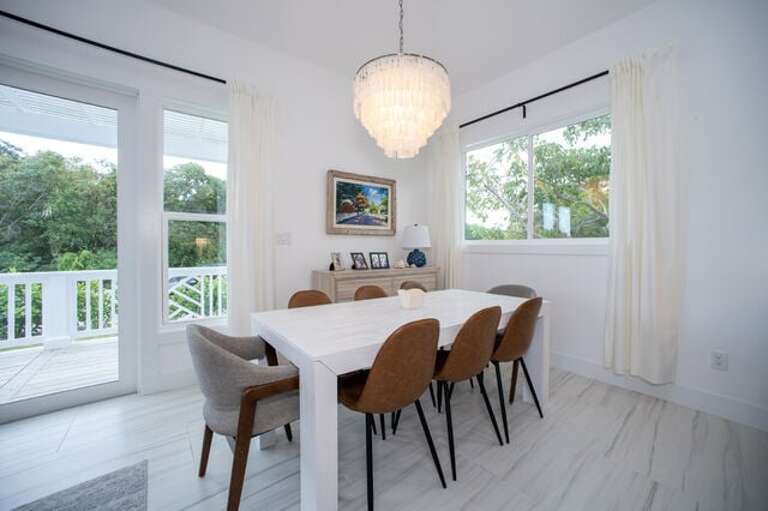 The sunny dining area has seating for up to eight.