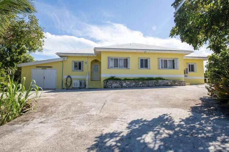 Exterior of house with ample free parking.