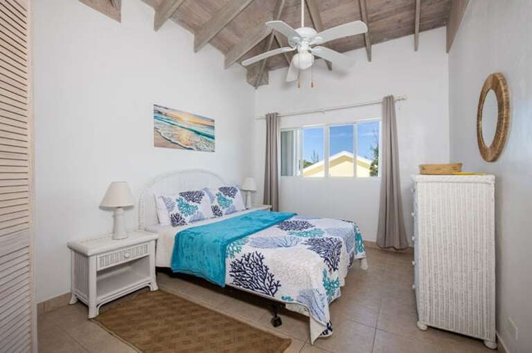 Guest Bedroom One with queen size bed.