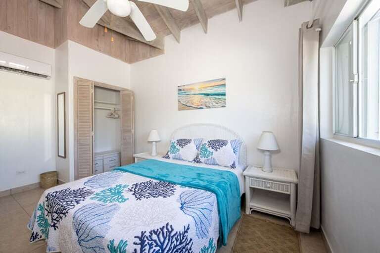 Guest Bedroom One with queen size bed.