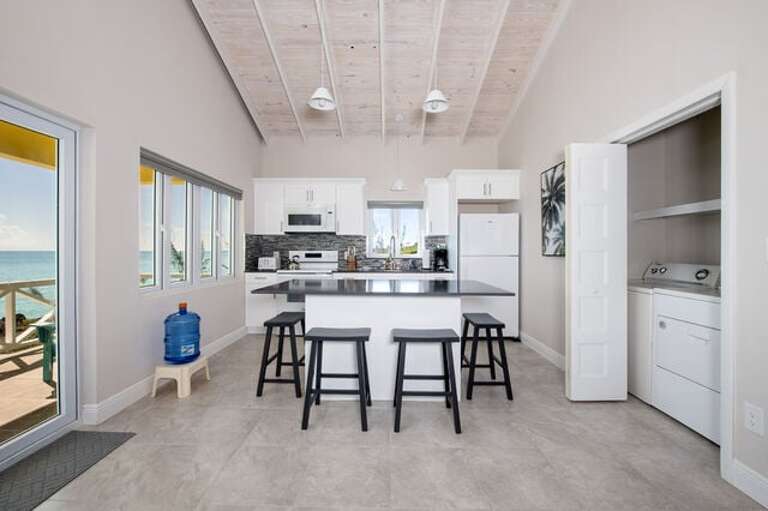 The Guest Cottage island kitchen has seating for 4 and is fully equipped.