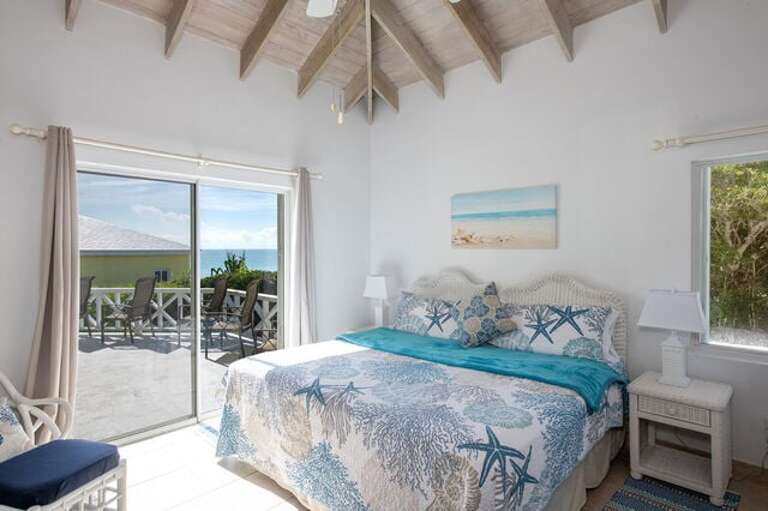 The Main House features a master bedroom suite with a king bed and an en-suite full bath.