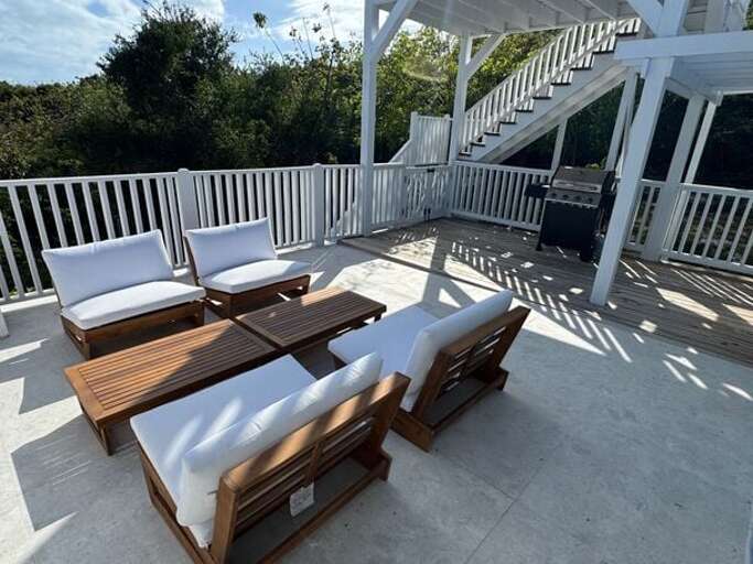 Large elevated patio with gas grill located just off the master suite and the twin bedroom.