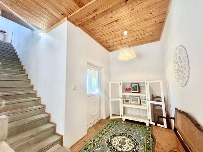 Stairs to loft bedroom and upstairs living area.